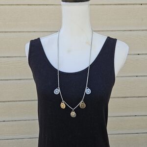long silver tone chain necklace with gold and silver medallions